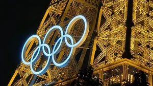 X | Team India : Olympics logo on the Eiffel Tower in Paris.